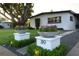 Charming single-story home with mature tree, attractive landscaping and planter lined walkway at 319 Halsey St, Orlando, FL 32839