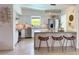 Modern kitchen featuring white cabinetry, stainless steel appliances, and breakfast bar at 319 Halsey St, Orlando, FL 32839