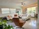 Inviting living room with polished floors, neutral furniture, and abundant natural light at 319 Halsey St, Orlando, FL 32839
