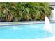 Pool with a fountain, beautiful tile, and landscaping at 319 Halsey St, Orlando, FL 32839