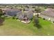 Expansive backyard with covered patio on a well-manicured lawn; perfect for outdoor entertaining at 32004 Redtail Reserve Blvd, Sorrento, FL 32776