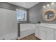 Bathroom featuring a white vanity, soaking tub, and separate glass enclosed shower at 32004 Redtail Reserve Blvd, Sorrento, FL 32776