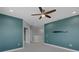 A spacious bedroom with a ceiling fan, recessed lighting, and light gray carpet at 32004 Redtail Reserve Blvd, Sorrento, FL 32776