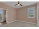 Serene bedroom with natural light, neutral carpet and ensuite bath access at 32004 Redtail Reserve Blvd, Sorrento, FL 32776