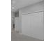 Hallway closet with bi-fold doors offering ample storage space at 32004 Redtail Reserve Blvd, Sorrento, FL 32776