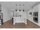 Bright kitchen featuring white cabinets, a center island, pendant lights, and stainless steel appliances at 32004 Redtail Reserve Blvd, Sorrento, FL 32776