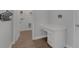 Well-organized laundry room with built-in desk and storage space at 32004 Redtail Reserve Blvd, Sorrento, FL 32776
