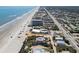Scenic aerial shot of the beachfront house and neighborhood, illustrating its proximity to the beach at 3309 Hill St, New Smyrna Beach, FL 32169
