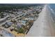 Aerial view of the beach community, highlighting the property's proximity to the beach and neighborhood at 3309 Hill St, New Smyrna Beach, FL 32169