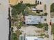 Breathtaking aerial view of a stunning beach home, featuring rooftop deck, sandy shores, and lush landscape at 3309 Hill St, New Smyrna Beach, FL 32169