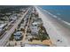 Overhead view of the beach area with house; nearby ocean, homes, and street shown at 3309 Hill St, New Smyrna Beach, FL 32169