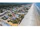Stunning aerial view of a beach house close to the ocean. Perfect for relaxing vacations at 3309 Hill St, New Smyrna Beach, FL 32169