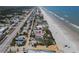 Aerial view of the house with pin showing location near the beach and the rest of the community at 3309 Hill St, New Smyrna Beach, FL 32169