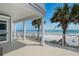 Spacious balcony with white railings offering stunning views of the ocean and beach at 3309 Hill St, New Smyrna Beach, FL 32169