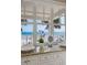 Bright bathroom showcasing large window with expansive ocean views and white cabinetry at 3309 Hill St, New Smyrna Beach, FL 32169