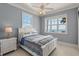Comfortable bedroom with ocean views and a ceiling fan for relaxed living at 3309 Hill St, New Smyrna Beach, FL 32169
