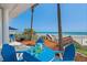 Enjoy outdoor living on the deck with ocean views, perfect for dining or relaxing with a drink at 3309 Hill St, New Smyrna Beach, FL 32169