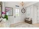 Bright entryway with tile floors, wall art, and a decorative bench at 3309 Hill St, New Smyrna Beach, FL 32169