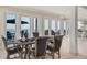 Bright game room with poker table and ocean views through large windows at 3309 Hill St, New Smyrna Beach, FL 32169