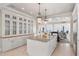 Spacious kitchen with an island and views into the open floor plan and outdoor living area at 3309 Hill St, New Smyrna Beach, FL 32169