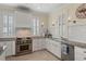 Well-equipped kitchen with granite countertops, stainless steel appliances, and ample cabinet space at 3309 Hill St, New Smyrna Beach, FL 32169