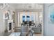 Open-concept living area with fireplace, bar, dining, and ocean views at 3309 Hill St, New Smyrna Beach, FL 32169