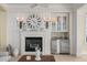 Living room features a fireplace, built-in bar, and decorative wall clock at 3309 Hill St, New Smyrna Beach, FL 32169