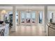 Open living space with large sliding doors leading to the deck and an ocean view at 3309 Hill St, New Smyrna Beach, FL 32169