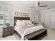 Stylish main bedroom featuring a ceiling fan, decorative wall art, and light and bright decor at 3309 Hill St, New Smyrna Beach, FL 32169
