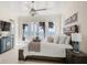 Beautiful bedroom with beach view, balcony access, and elegant coastal-themed decor at 3309 Hill St, New Smyrna Beach, FL 32169