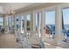 Relaxing sunroom with ocean views and access to the deck with cozy rocking chairs at 3309 Hill St, New Smyrna Beach, FL 32169