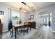 Elegant dining room with modern light fixture, stylish decor and wood laminate floors at 415 Eastbridge Dr, Oviedo, FL 32765