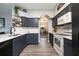 Bright kitchen with gray cabinets, tiled backsplash, and modern appliances at 415 Eastbridge Dr, Oviedo, FL 32765