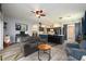 Open concept kitchen with a breakfast bar, gray cabinets, and laminate wood floors at 415 Eastbridge Dr, Oviedo, FL 32765