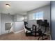 Upstairs loft with a simulator setup and natural light at 415 Eastbridge Dr, Oviedo, FL 32765