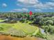 Beautiful aerial real estate view of a property with a private lake and serene surroundings at 419 Whitcomb Dr, Geneva, FL 32732