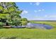 Picturesque backyard featuring a tranquil waterside view with kayaks ready for serene water adventures at 419 Whitcomb Dr, Geneva, FL 32732