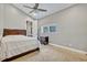 Comfortable bedroom featuring carpeted floors, a window, and neutral-colored walls at 419 Whitcomb Dr, Geneva, FL 32732