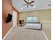 Bedroom featuring carpeted floors, a workstation, and a comfortable day bed at 419 Whitcomb Dr, Geneva, FL 32732