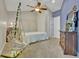 Cozy bedroom with a decorative swing and ceiling fan providing a calm ambiance at 419 Whitcomb Dr, Geneva, FL 32732