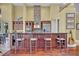 Beautiful kitchen featuring custom cabinetry, granite countertops, stainless steel appliances, and bar seating at 419 Whitcomb Dr, Geneva, FL 32732