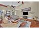 Inviting living room featuring high ceilings, hardwood floors, comfortable seating, and natural light at 419 Whitcomb Dr, Geneva, FL 32732