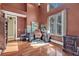 Well-lit home office featuring hardwood floors, desk with rolling chair, and a bright window at 419 Whitcomb Dr, Geneva, FL 32732