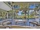 Relax on the screened porch and enjoy breathtaking views of the lush landscape and water at 419 Whitcomb Dr, Geneva, FL 32732