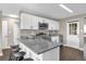 Bright kitchen featuring granite counters, modern appliances, and ample cabinet space at 461 Brentwood Dr, Daytona Beach, FL 32117