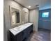 Bathroom featuring a double sink vanity with modern fixtures and ample counter space at 4720 Oak St, Fruitland Park, FL 34731