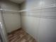 Spacious walk-in closet with wood-look floors and wire shelving at 4720 Oak St, Fruitland Park, FL 34731