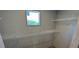 Walk-in closet with wire shelving to maximize storage space at 4720 Oak St, Fruitland Park, FL 34731
