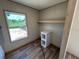 Image of closet space with bright window and built-in storage shelves at 4720 Oak St, Fruitland Park, FL 34731