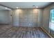 Spacious living room with stylish paneling and wood-look flooring at 4720 Oak St, Fruitland Park, FL 34731